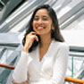 business professional woman smiling near a guard rail