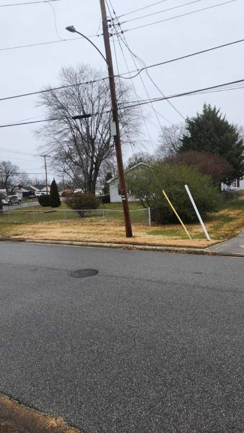 Telephone pole with many cables