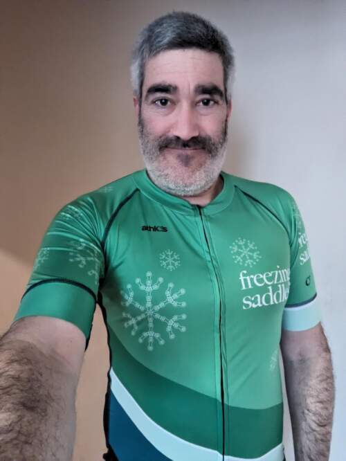 Selfie wearing a green Freezing Saddles bike jersey